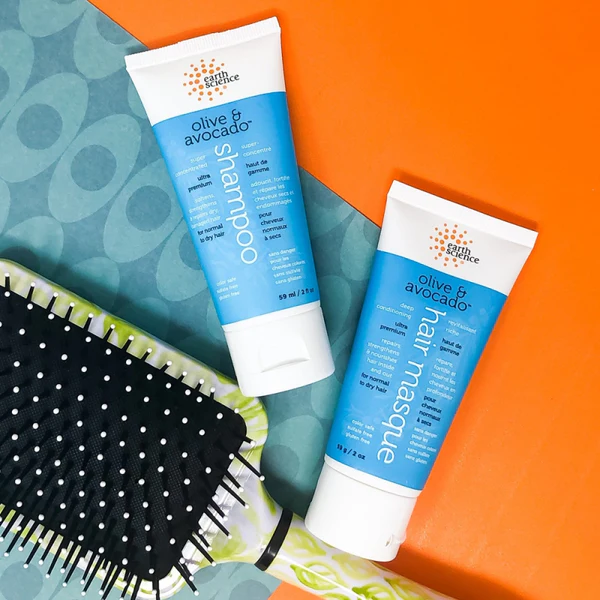 Earth Science Olive & Avocado Deep Conditioning Hair Masque jar displayed on a clean background, highlighting its nourishing and repairing hair care formula