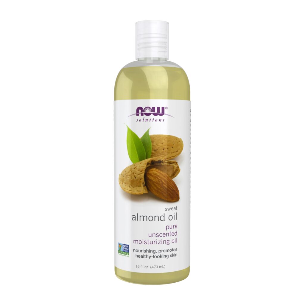 NOW Foods Sweet Almond Oil for skin and hair held by woman