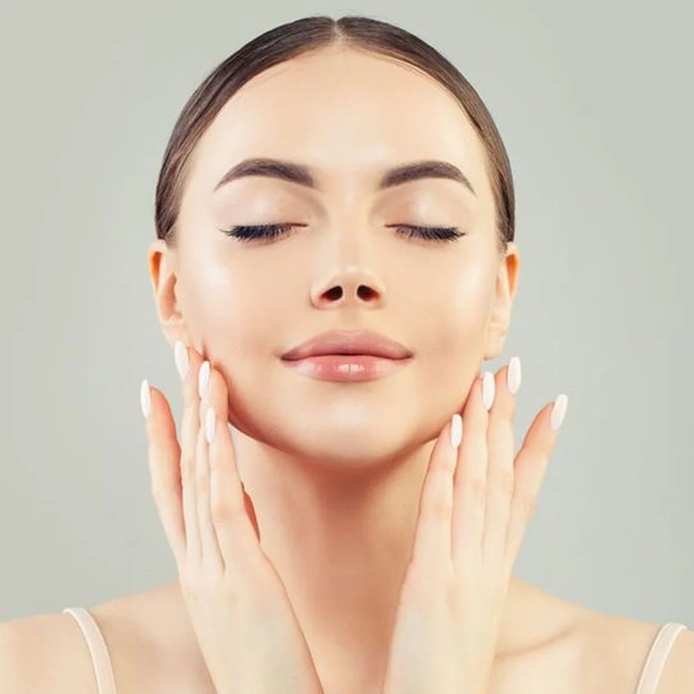 NOW Foods Sweet Almond Oil for skin and hair held by woman