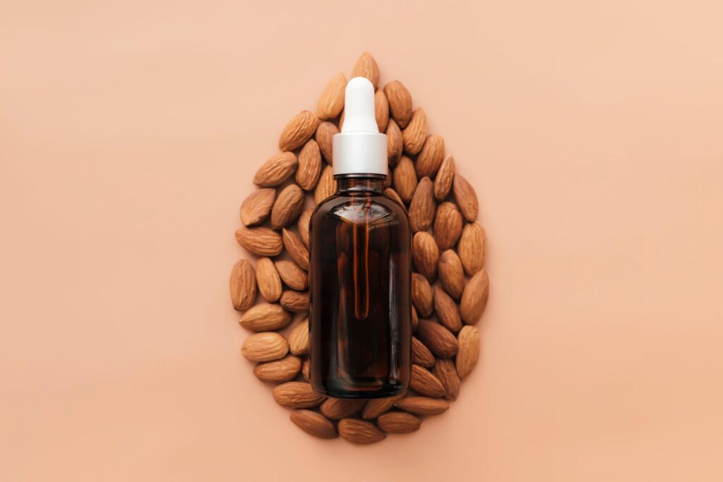 NOW Foods Sweet Almond Oil for skin and hair held by woman